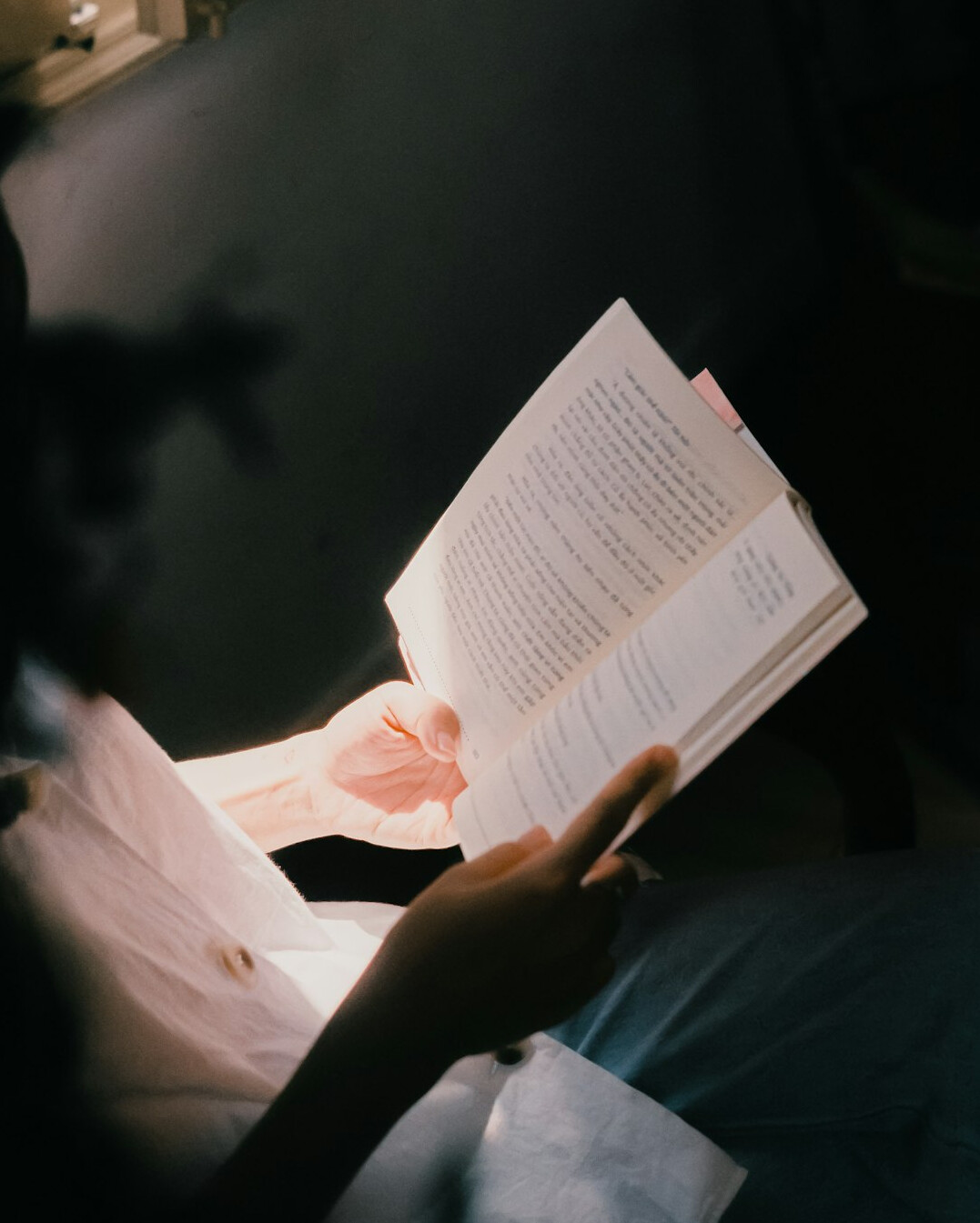 person reading financial book